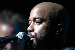 YOKOTA AIR BASE, Japan -- Darius Rucker, lead singer of Hootie and the Blowfish, sings to a crowd during an Operation Pacific Greetings tour concert here May 19.  The tour features performances by Band of the U.S. Air Force Reserve, the Pacific Air Force Band-Asia and New England Patriots' cheerleaders.  (U.S. Air Force photo by Master Sgt. Val Gempis)